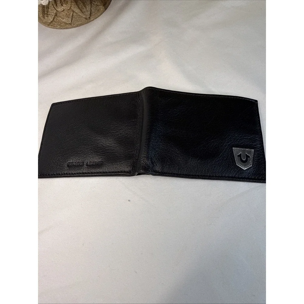 True Religion Men's Genuine Leather Black Bifold Wallet RFID Metal Logo.